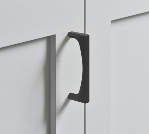 The Top Knobs Riverside pull in a Flat Black finish.